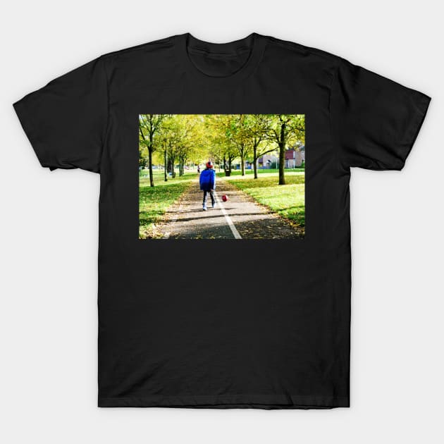 Boy playing football in autumn T-Shirt by fantastic-designs